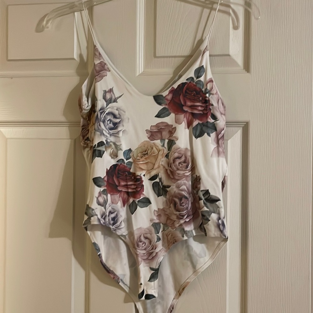 Floral body suit. Wonderful for spring and summer. Can be worn under a cardigan